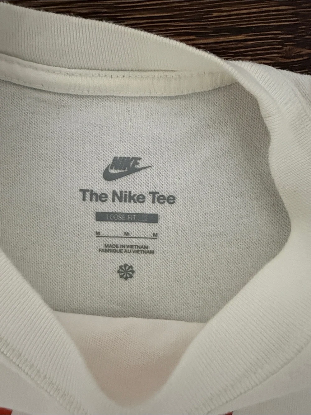 Nike White Short Sleeve Tee with Orange Swoosh Graphic